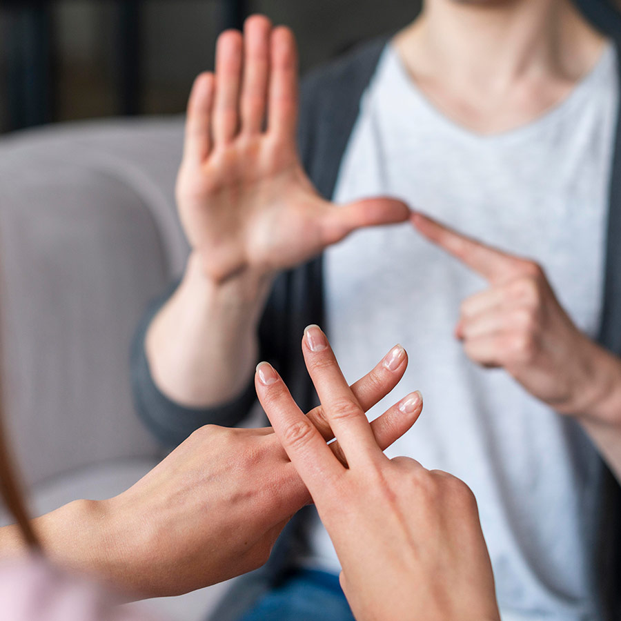 Couple talking using sign language