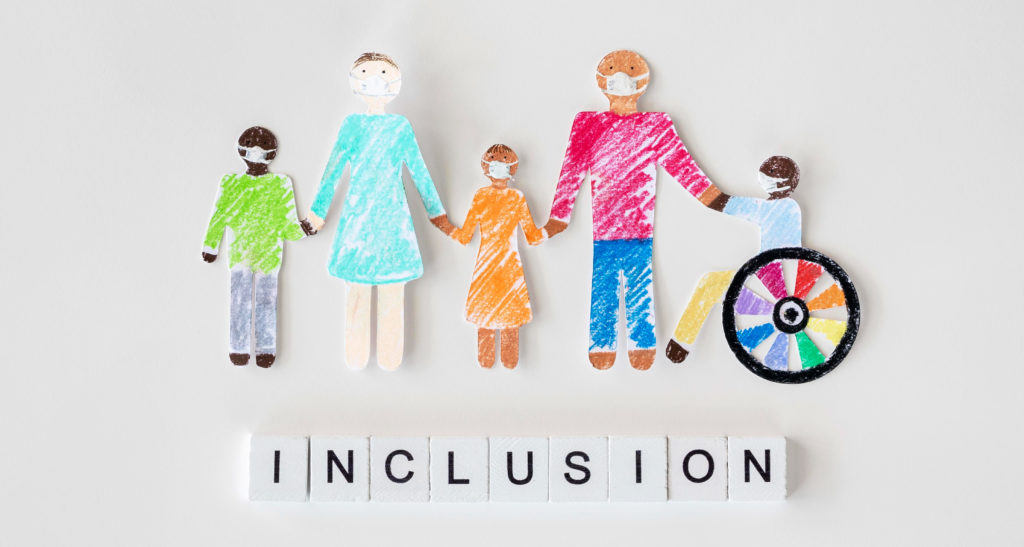Paper cutouts of individuals with the word inclusion underneath