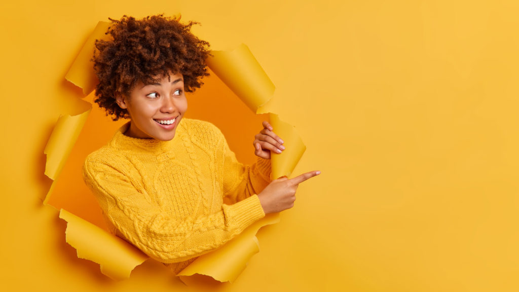 Young African American woman pointing